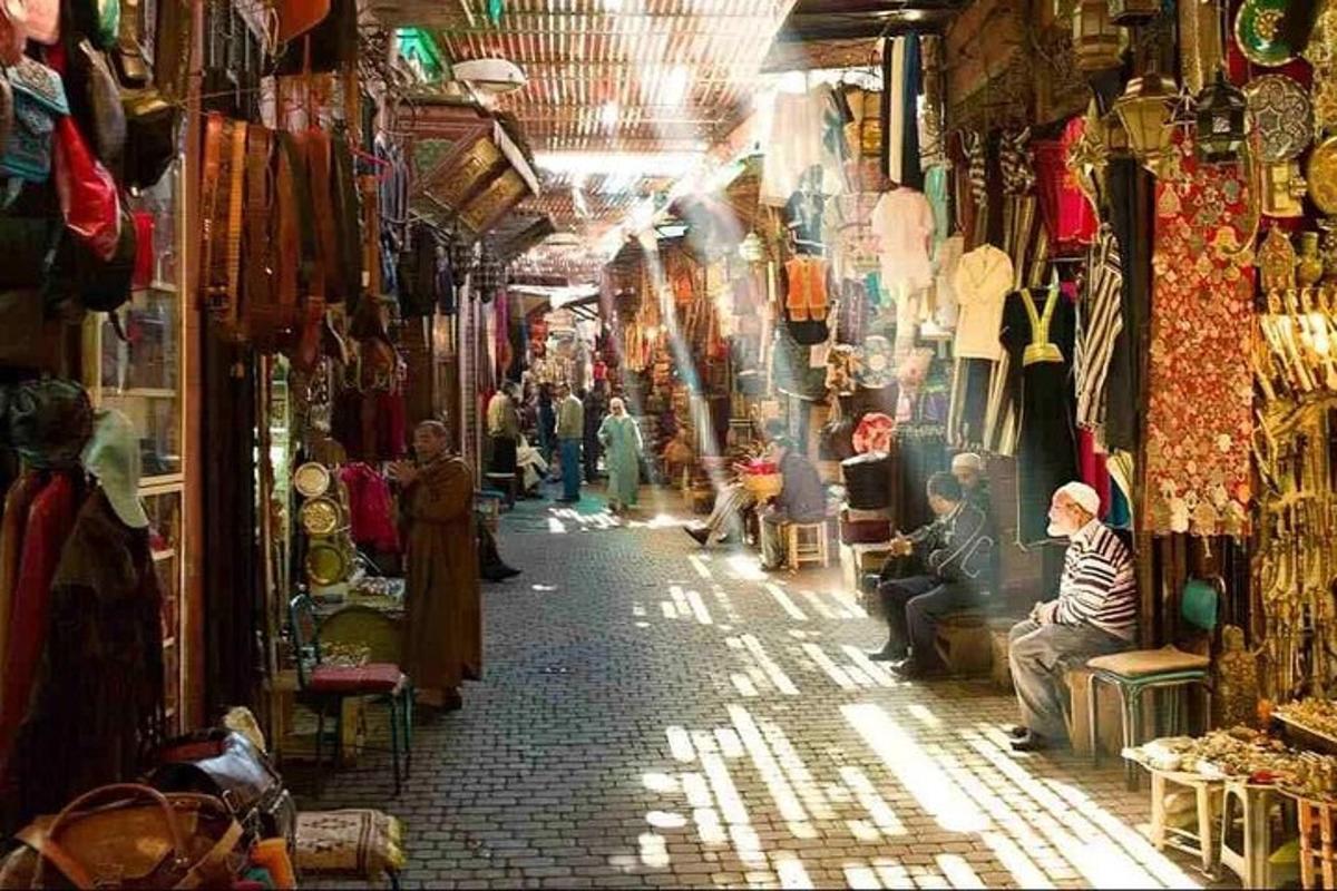 a group of people sitting in a shop in a market