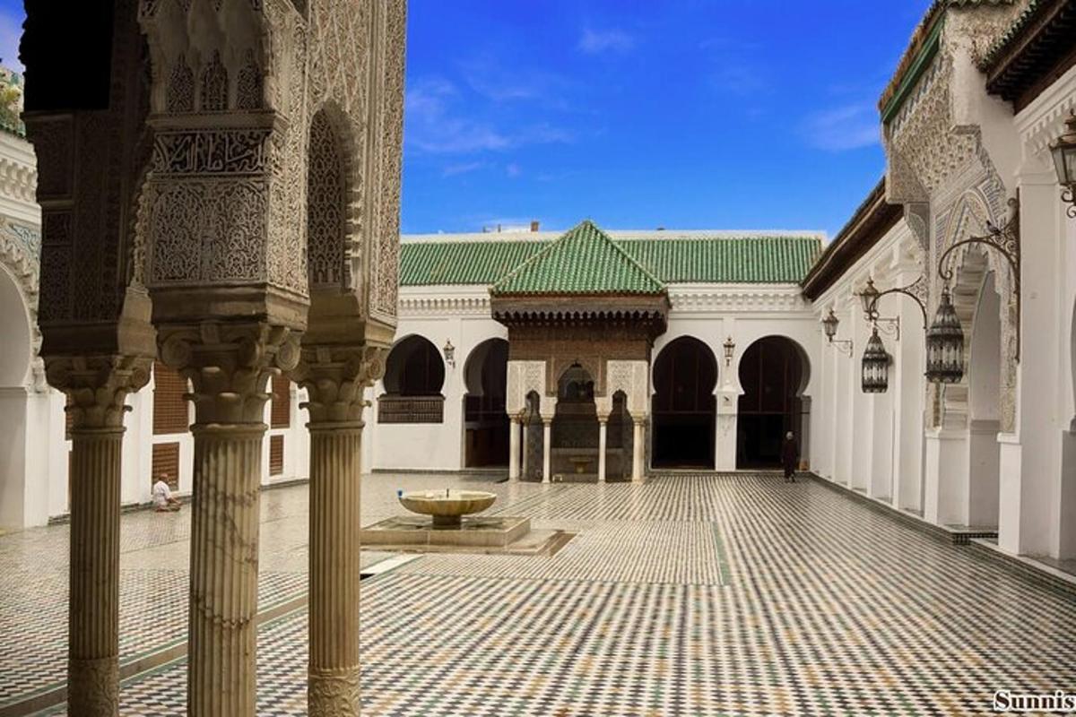 a courtyard with a fountain in the middle of a building