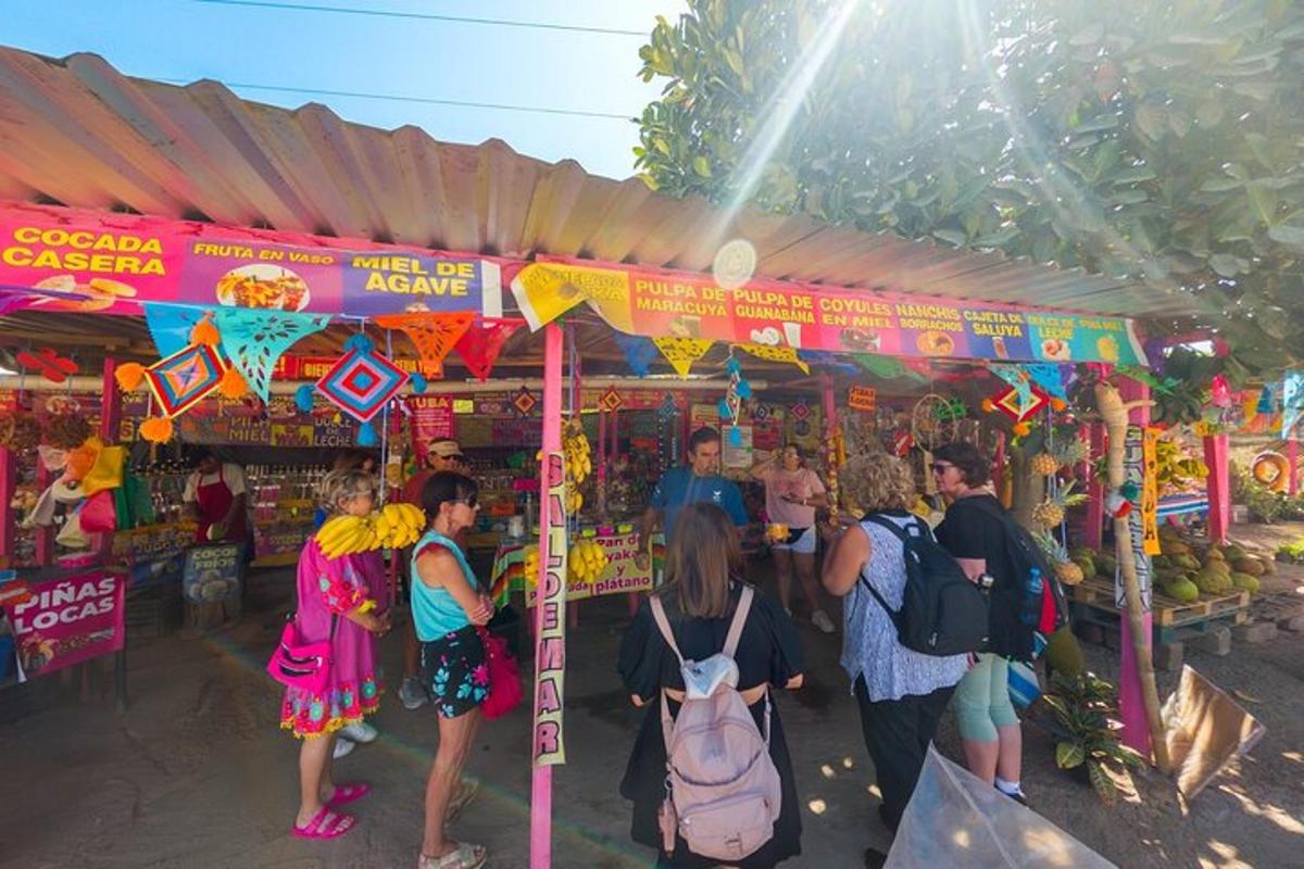 a group of people standing outside of a market