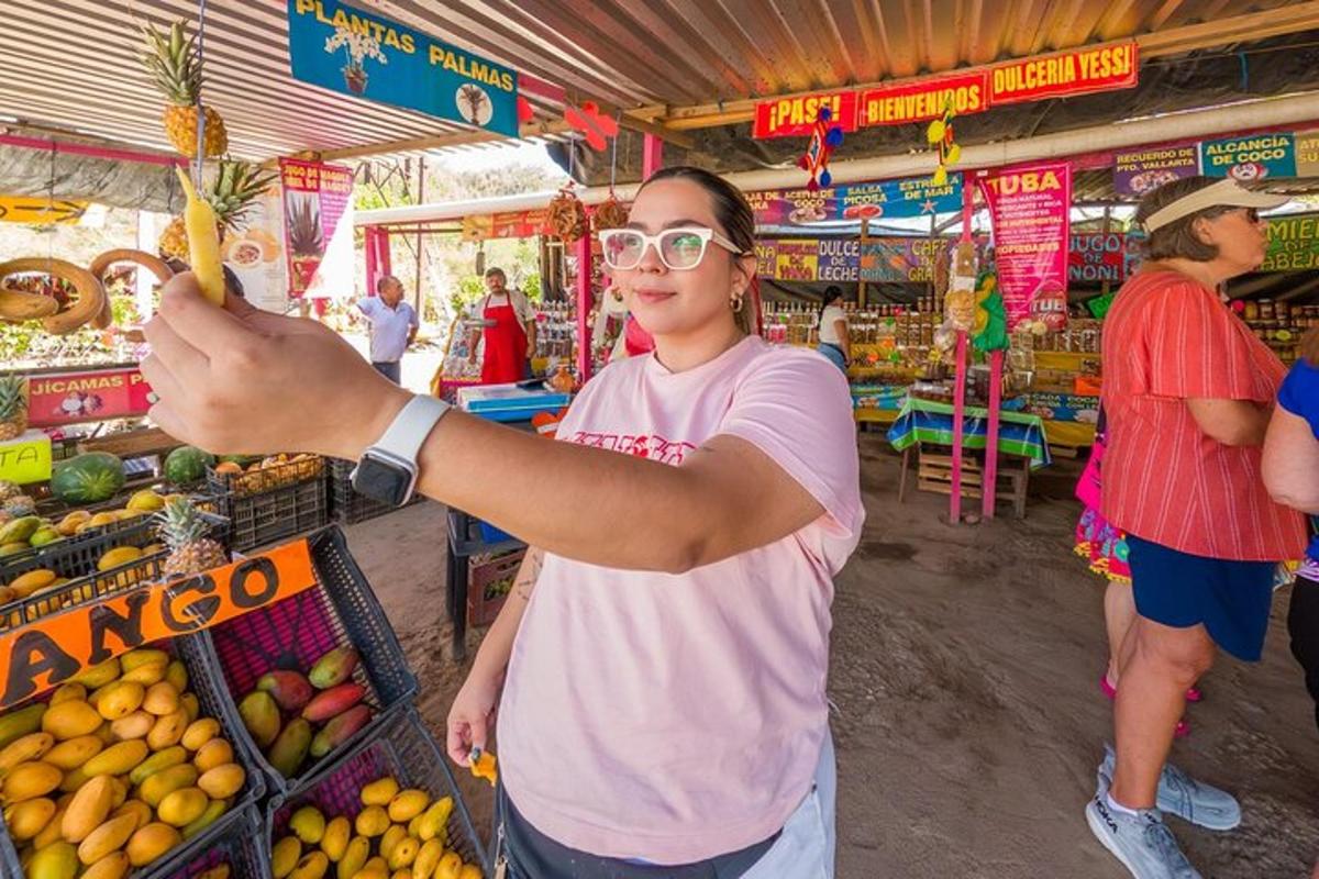 a woman holding a pineapple in a market