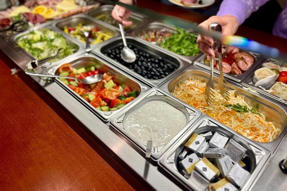 a tray filled with different types of food on a buffet