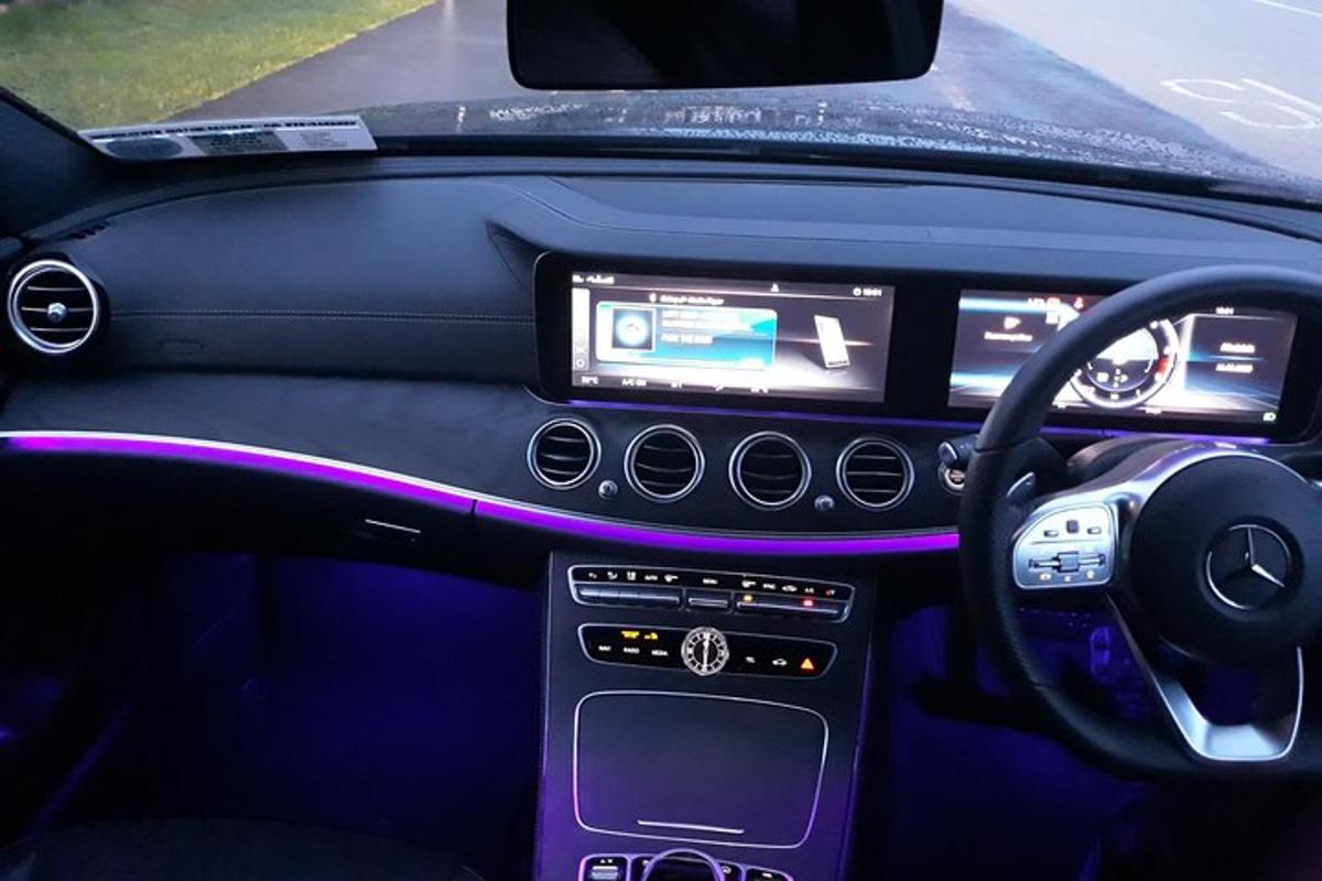 a view of the steering wheel and dashboard of acedes benz car