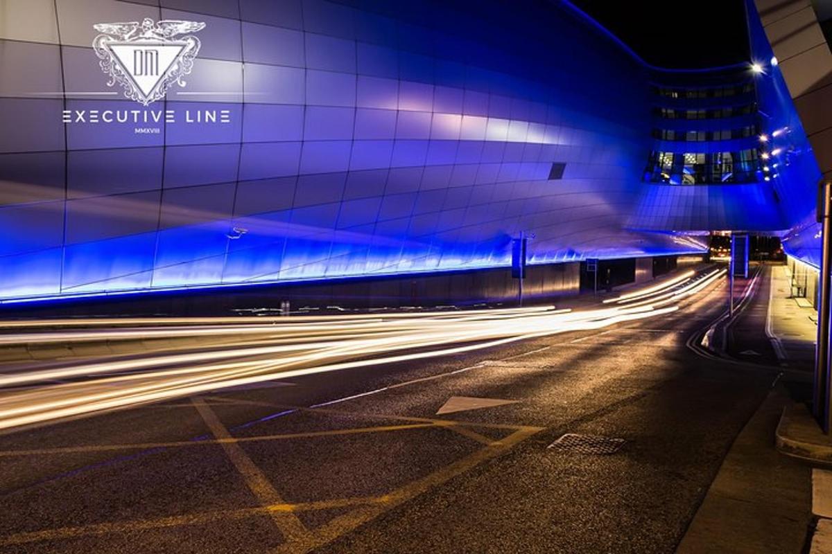 a city street with a building with blue lights