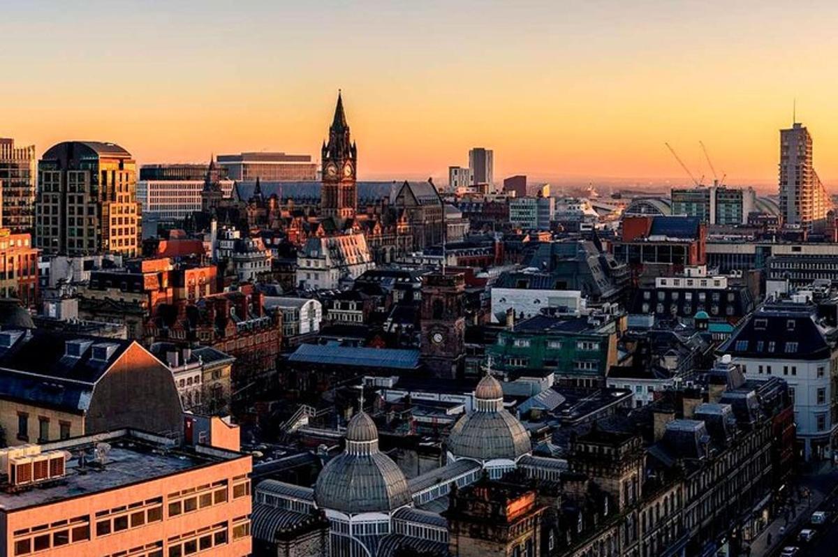 an aerial view of a city at sunset