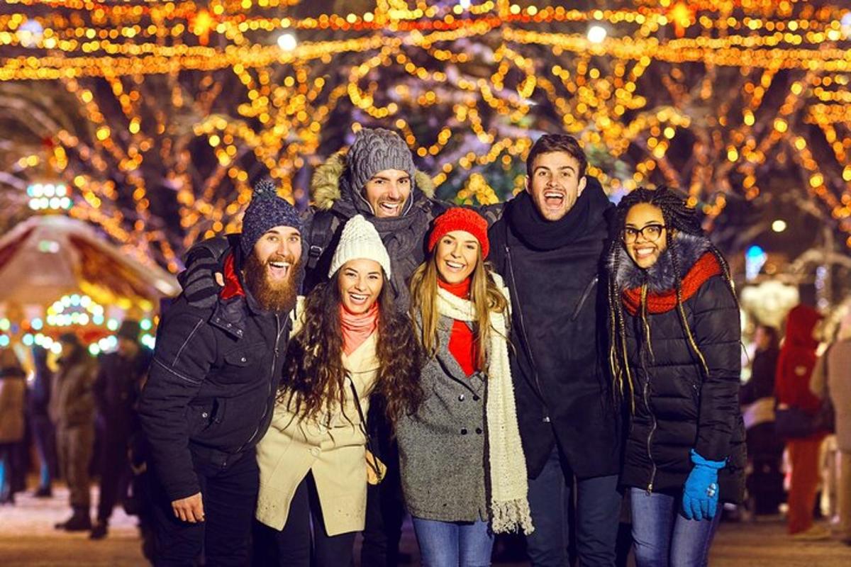 a group of people posing for a picture in front of lights