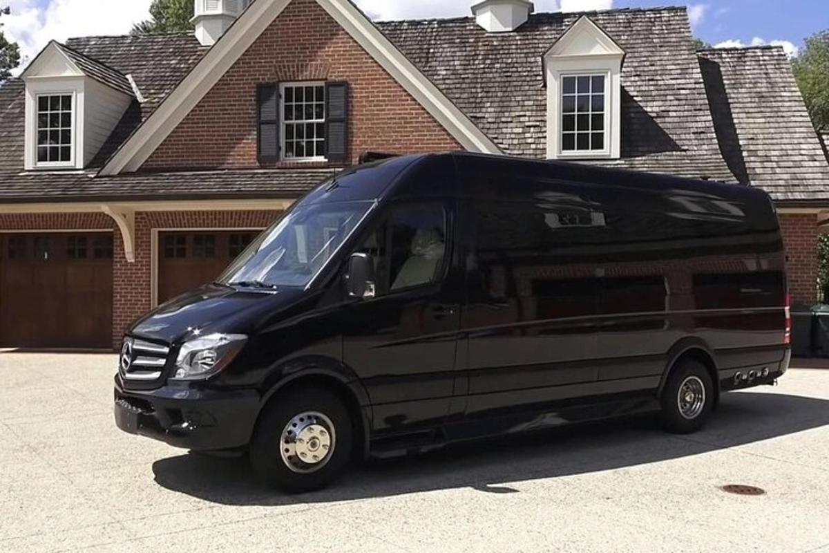 a black van parked in front of a house