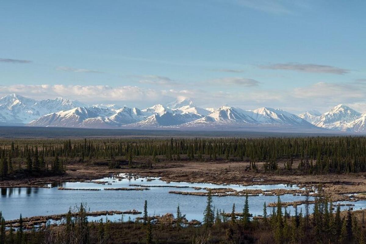 a view of a mountain range with snow covered mountains