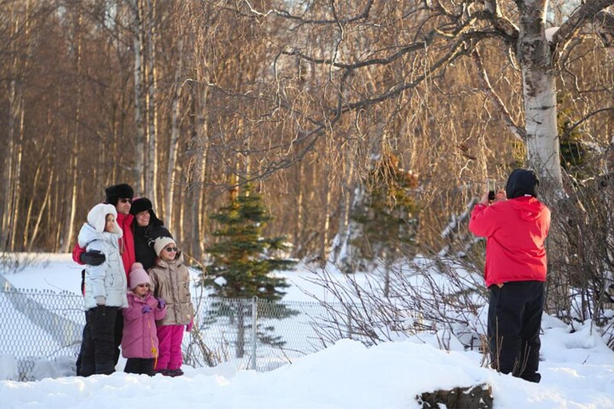 a group of people standing in the snow
