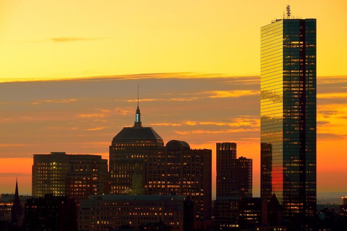 a view of a city skyline at sunset