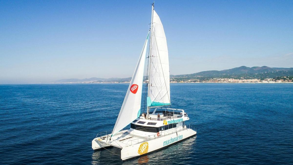 a white sailboat in the water on the ocean