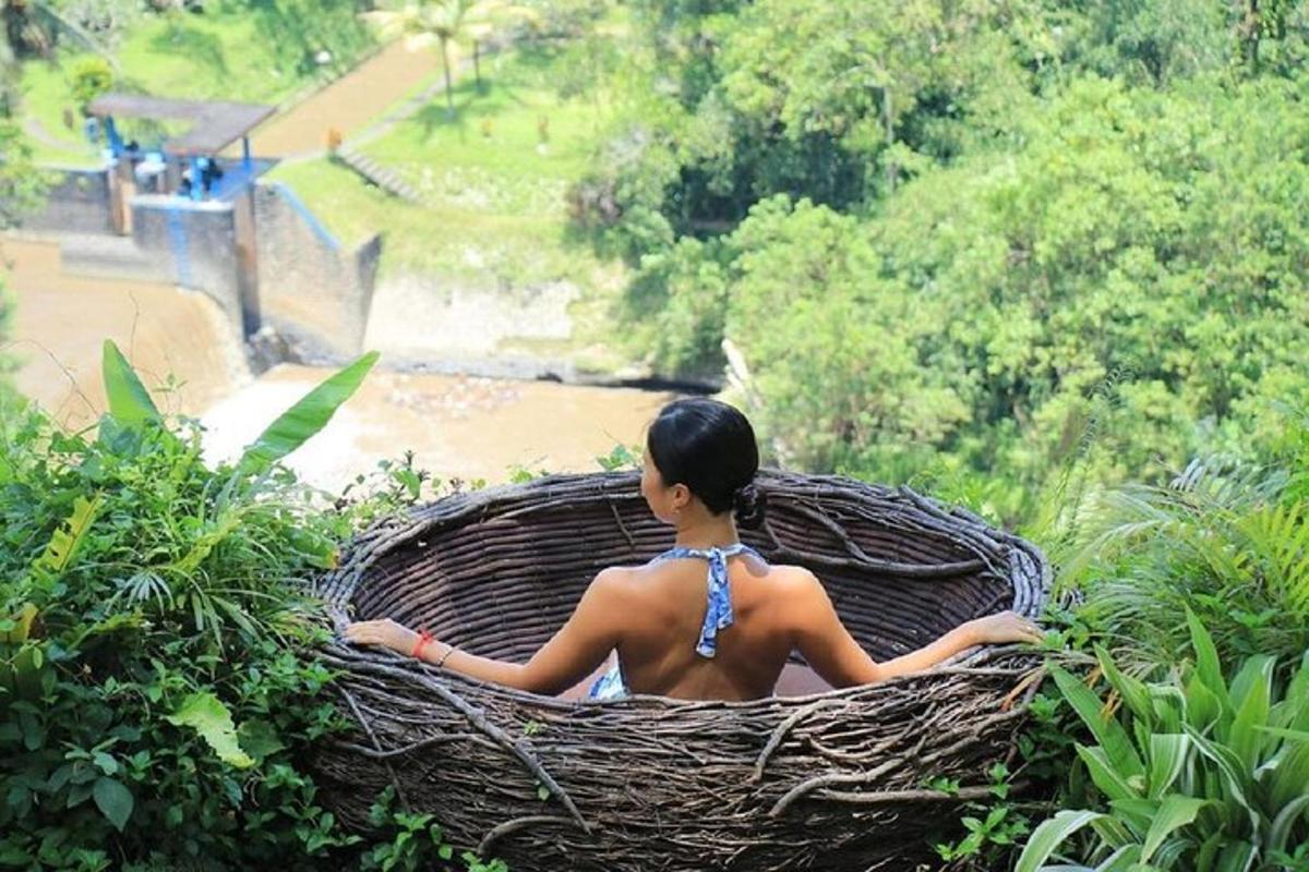 a woman sitting in a basket in front of a river