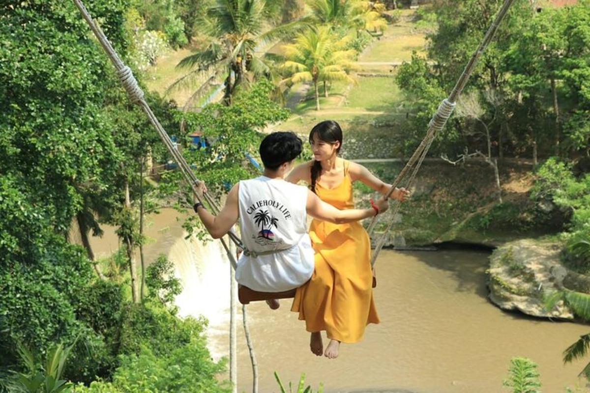 two people crossing a suspension bridge over a river