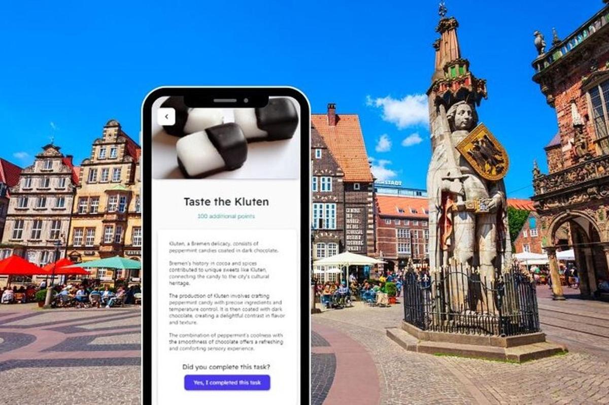 a phone taking a picture of a statue in a city