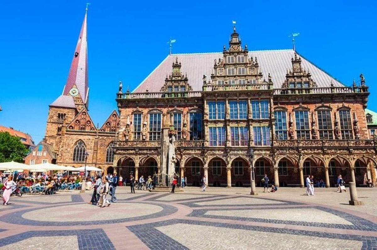 a large building with a clock tower in front of it