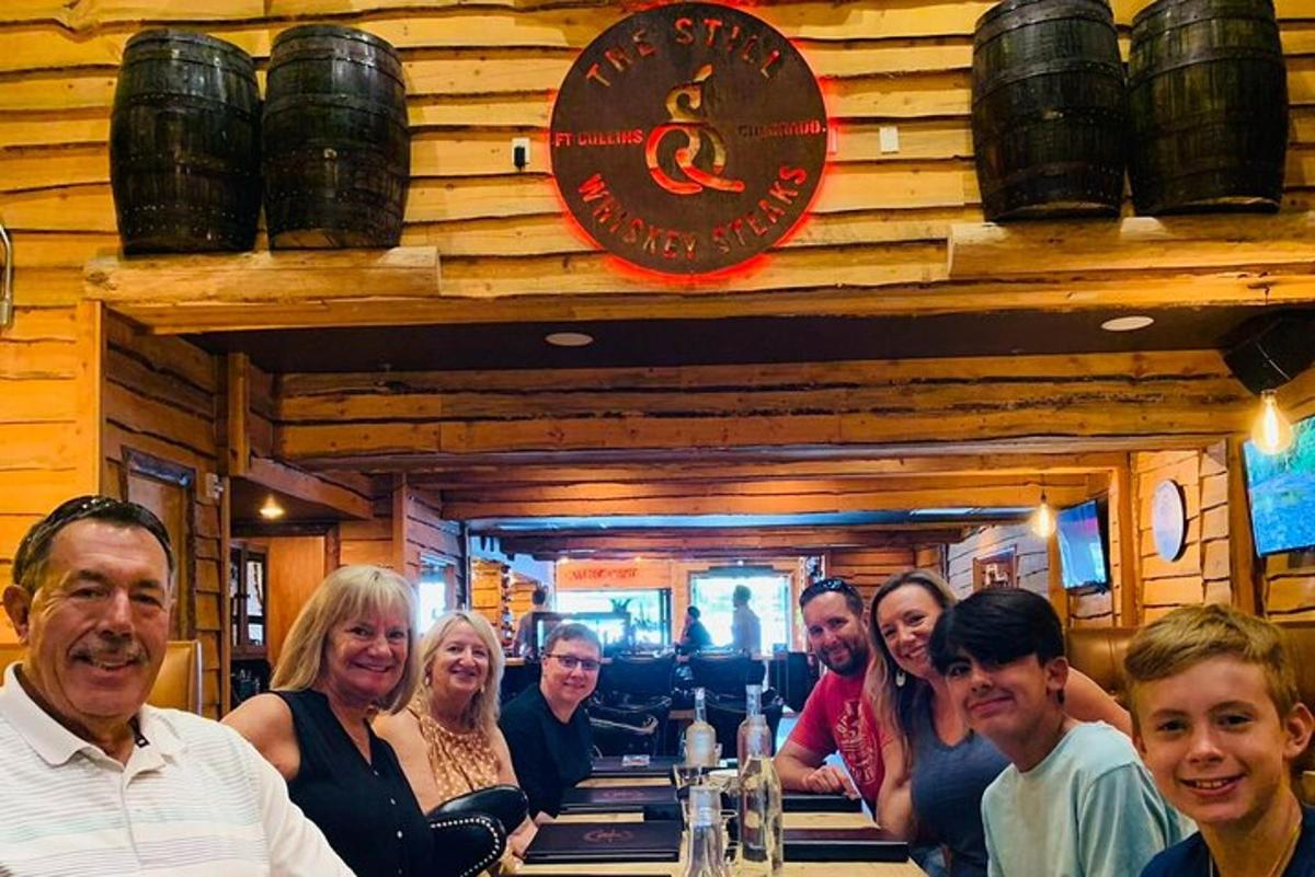 a group of people sitting at a bar