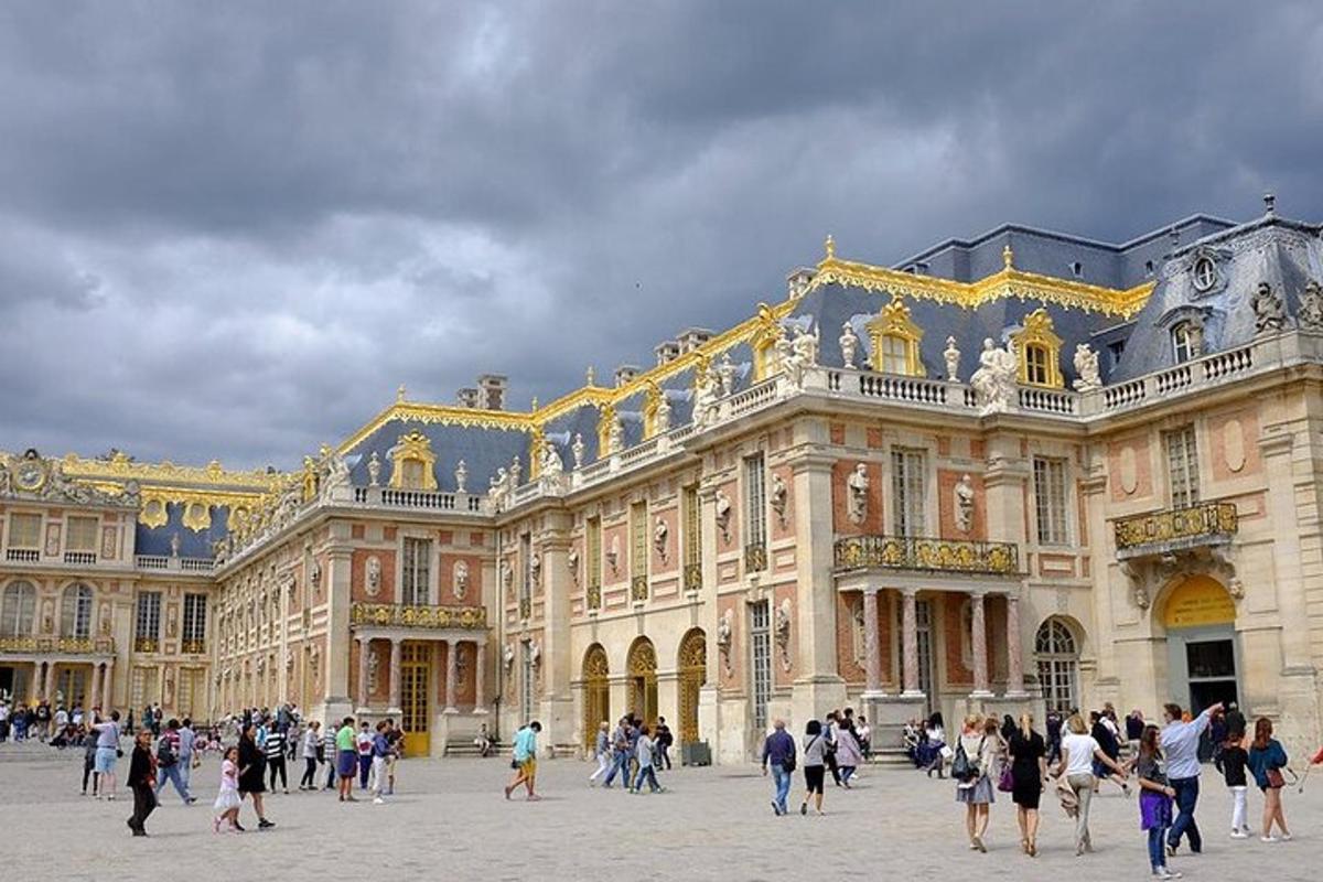 a group of people walking in front of a large building