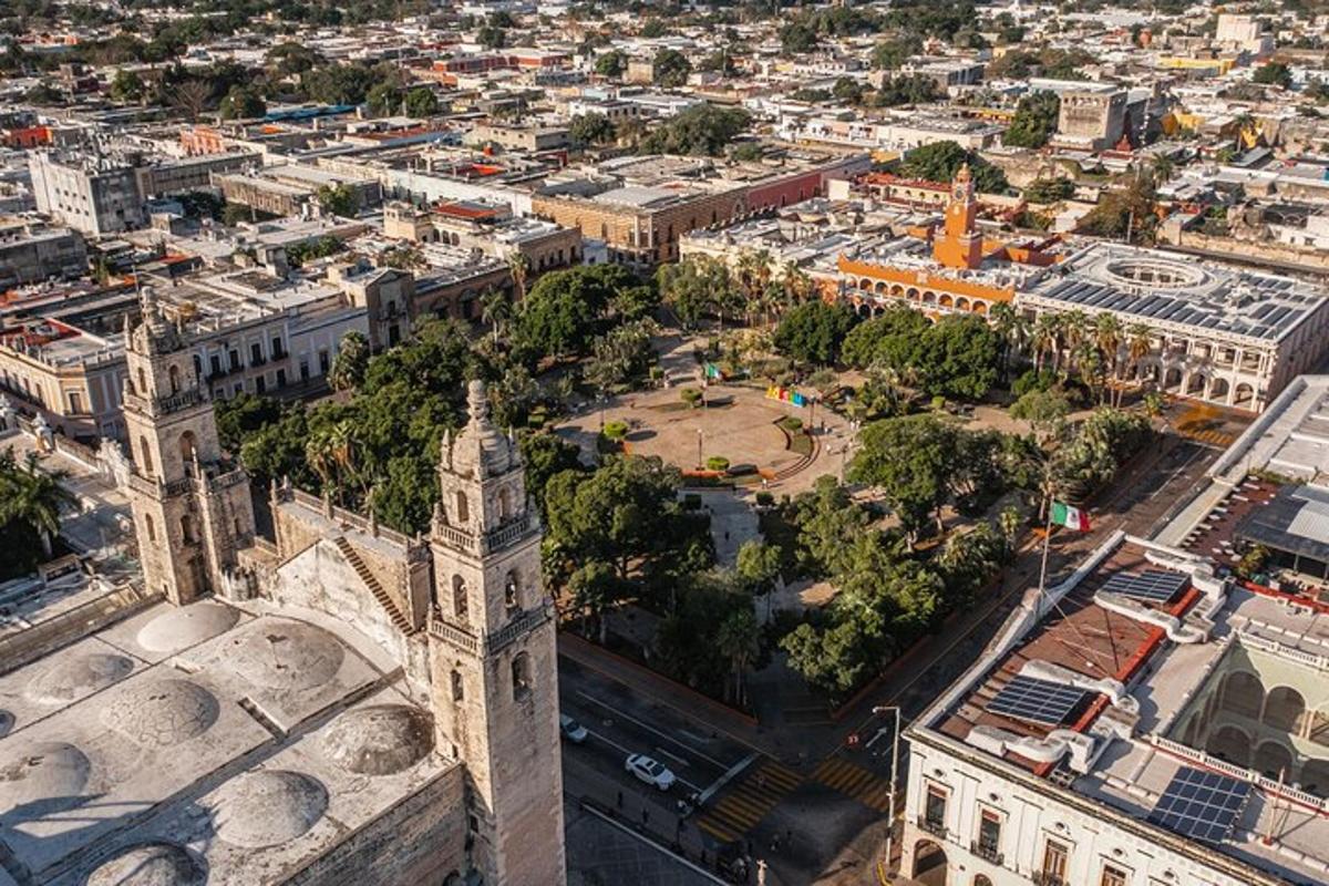 an aerial view of a city with a clock tower