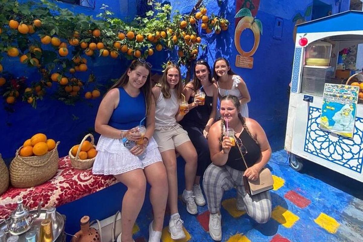 a group of women posing for a picture with drinks