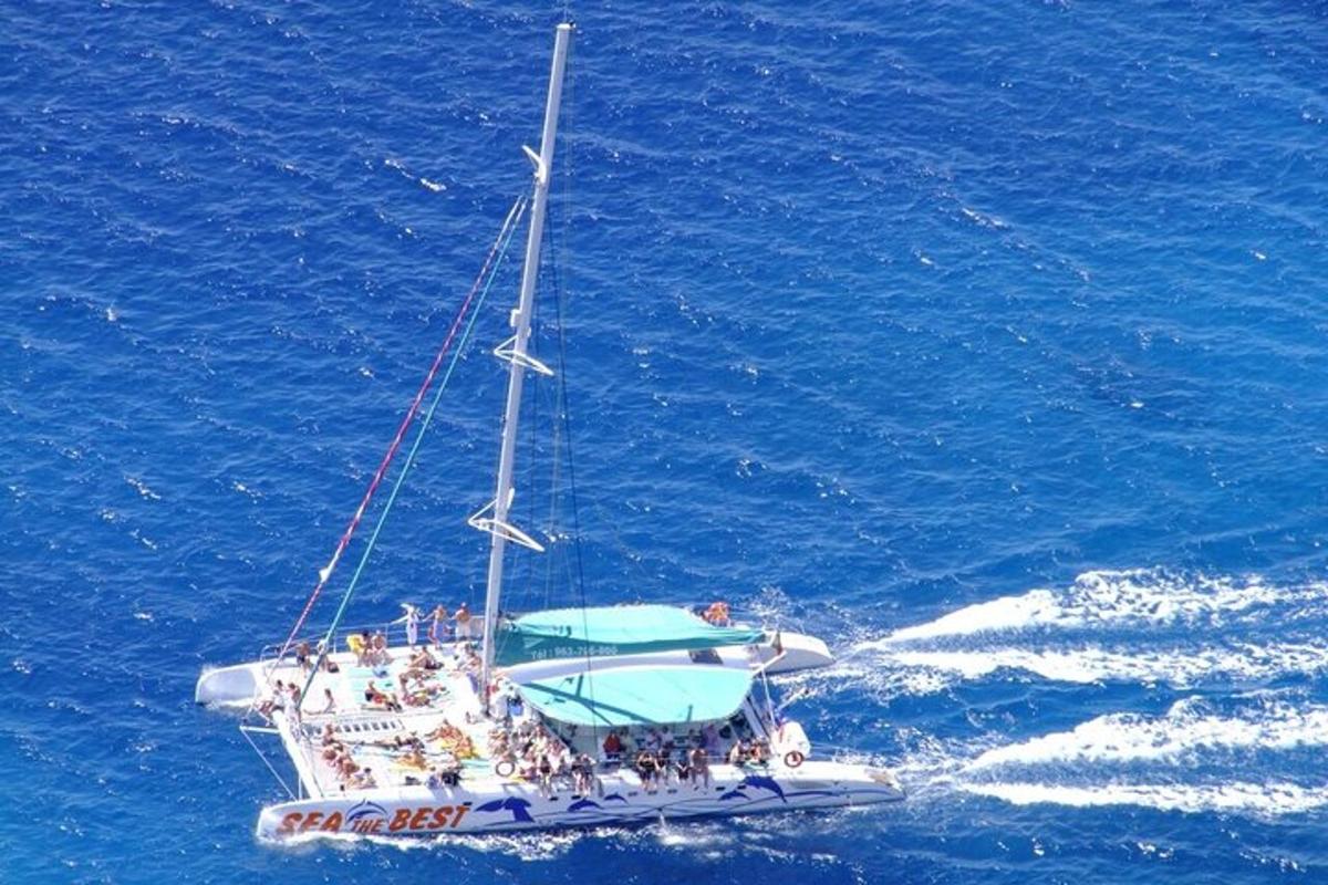 a group of people on a boat in the ocean