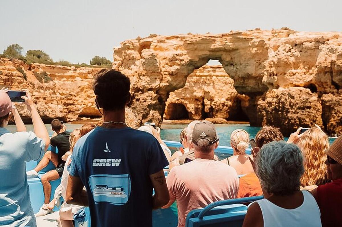 a group of people on a boat in a cave