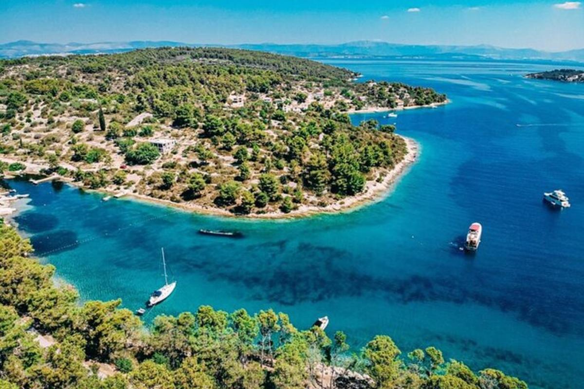 an island with boats in a large body of water
