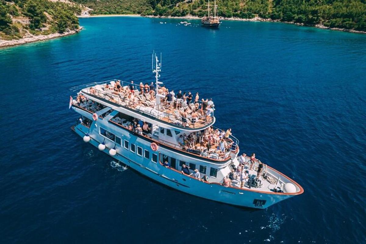 a large boat filled with people on the water