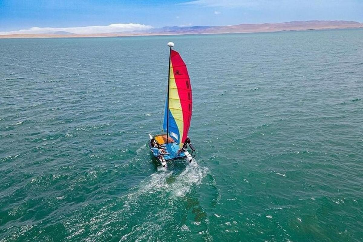 a person on a sail boat in the water