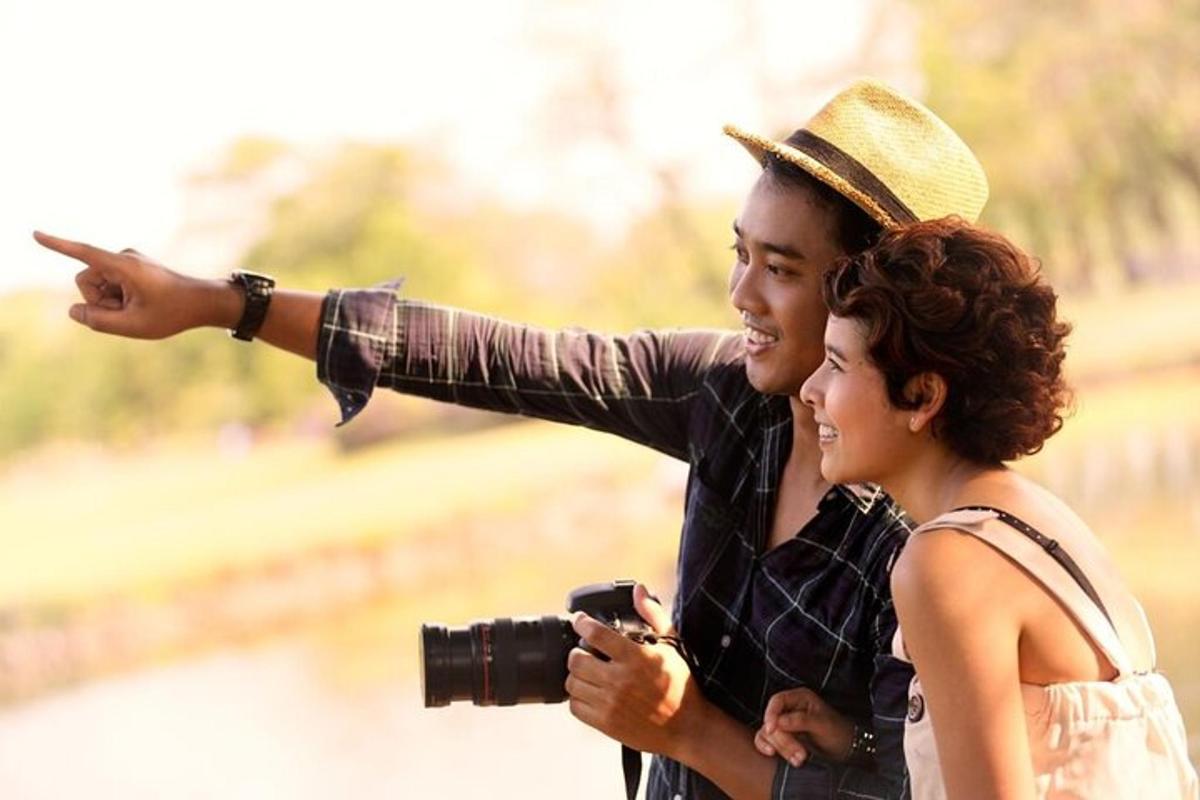 a man taking a picture of a woman with a camera