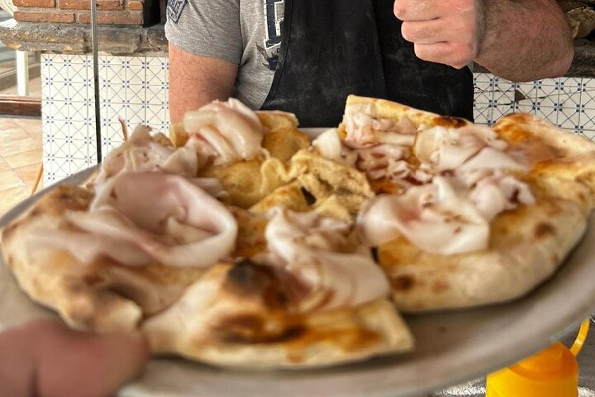 a pizza sitting on top of a plate on a table