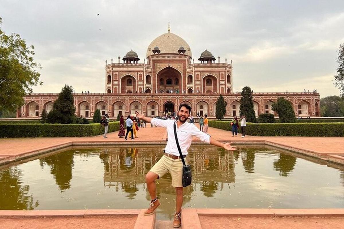 a man standing in front of a large building