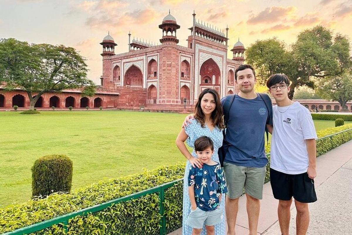 a family posing in front of a building