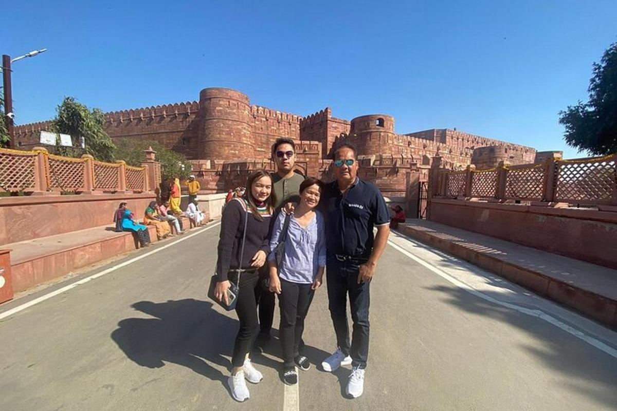 a group of people posing for a picture on a bridge