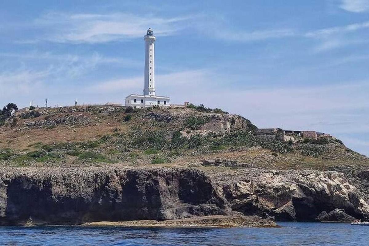 a lighthouse on top of an island in the water