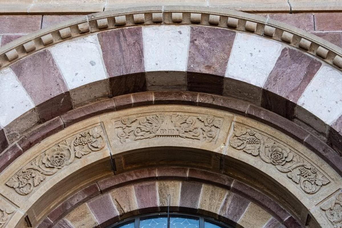 an archway over two windows on a building