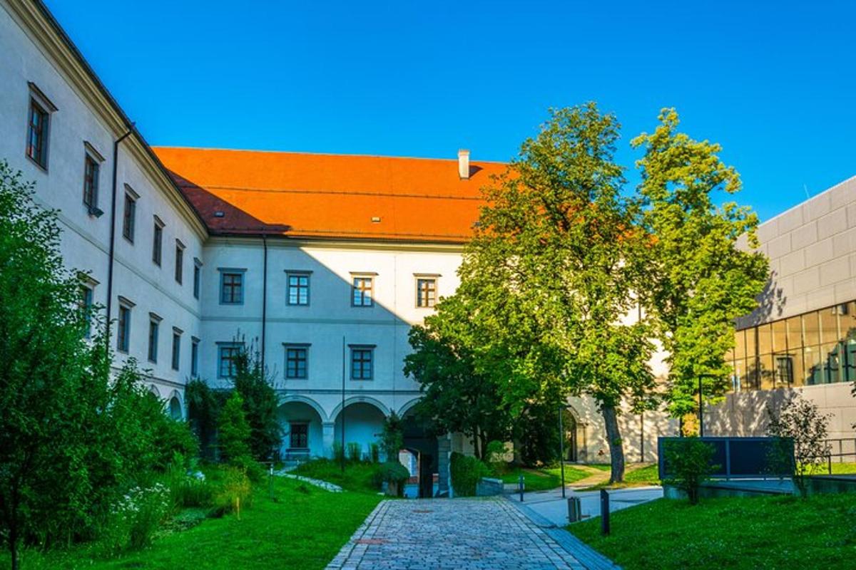 a large white building with an orange roof