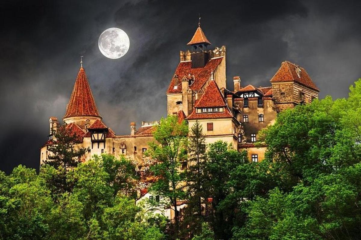 an old castle with a full moon in the sky