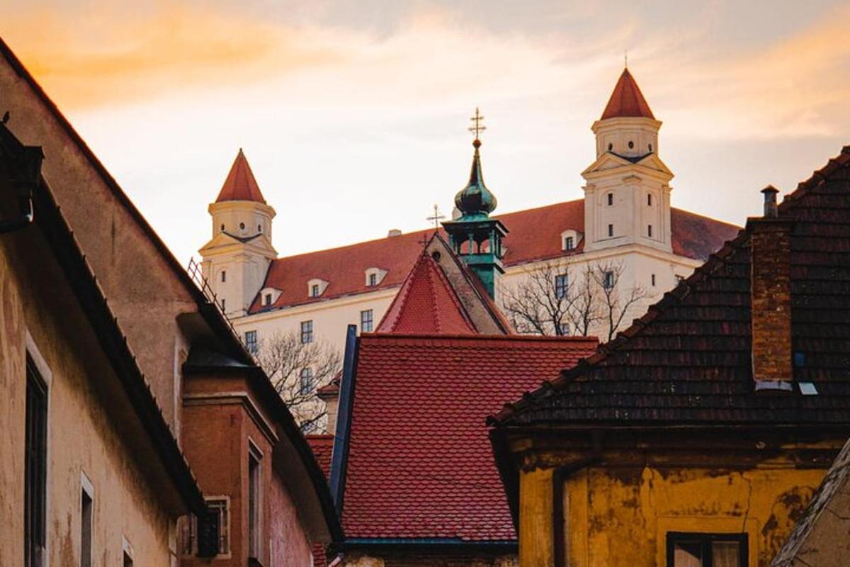 a group of buildings with a church in the background