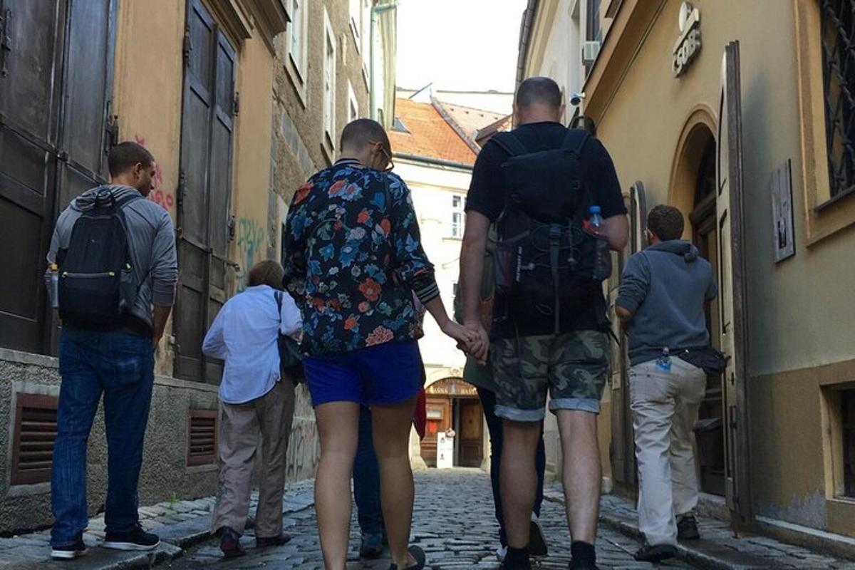 a group of people walking down a alley