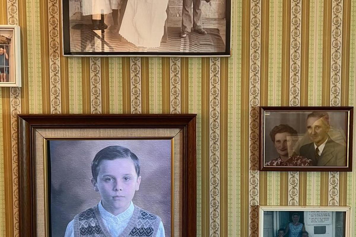 a wall with portraits of a man and a woman