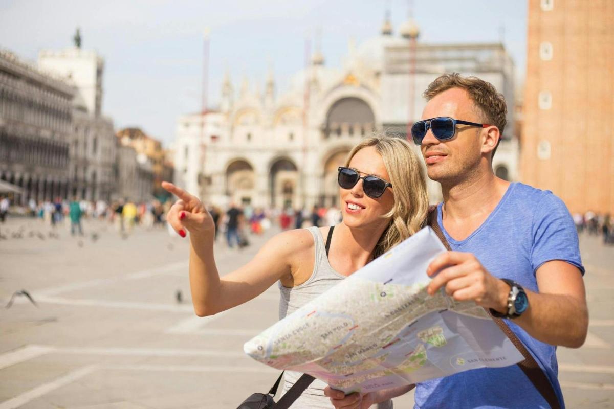 a man and a woman looking at a map