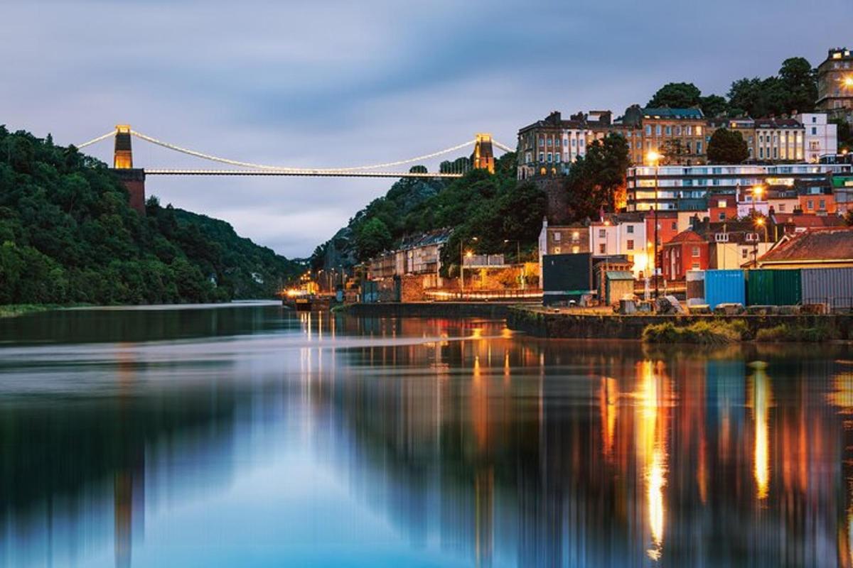 a view of a river with a bridge in the background