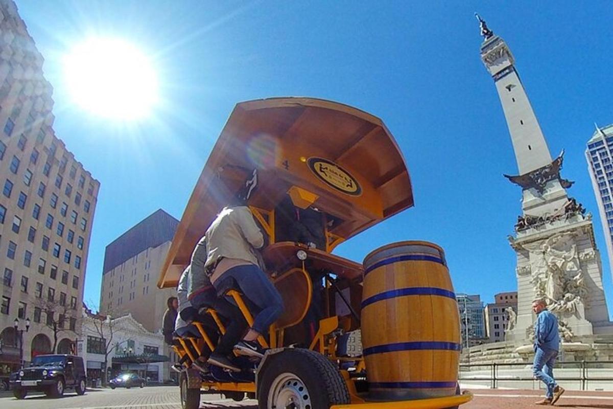 a statue of a man holding a barrel