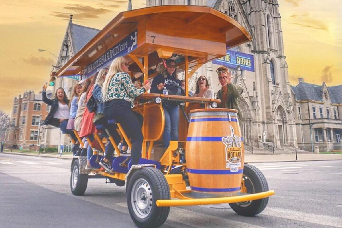 a group of people riding on a beer barrel car