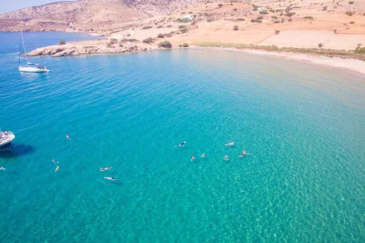 a group of people swimming in a large body of water