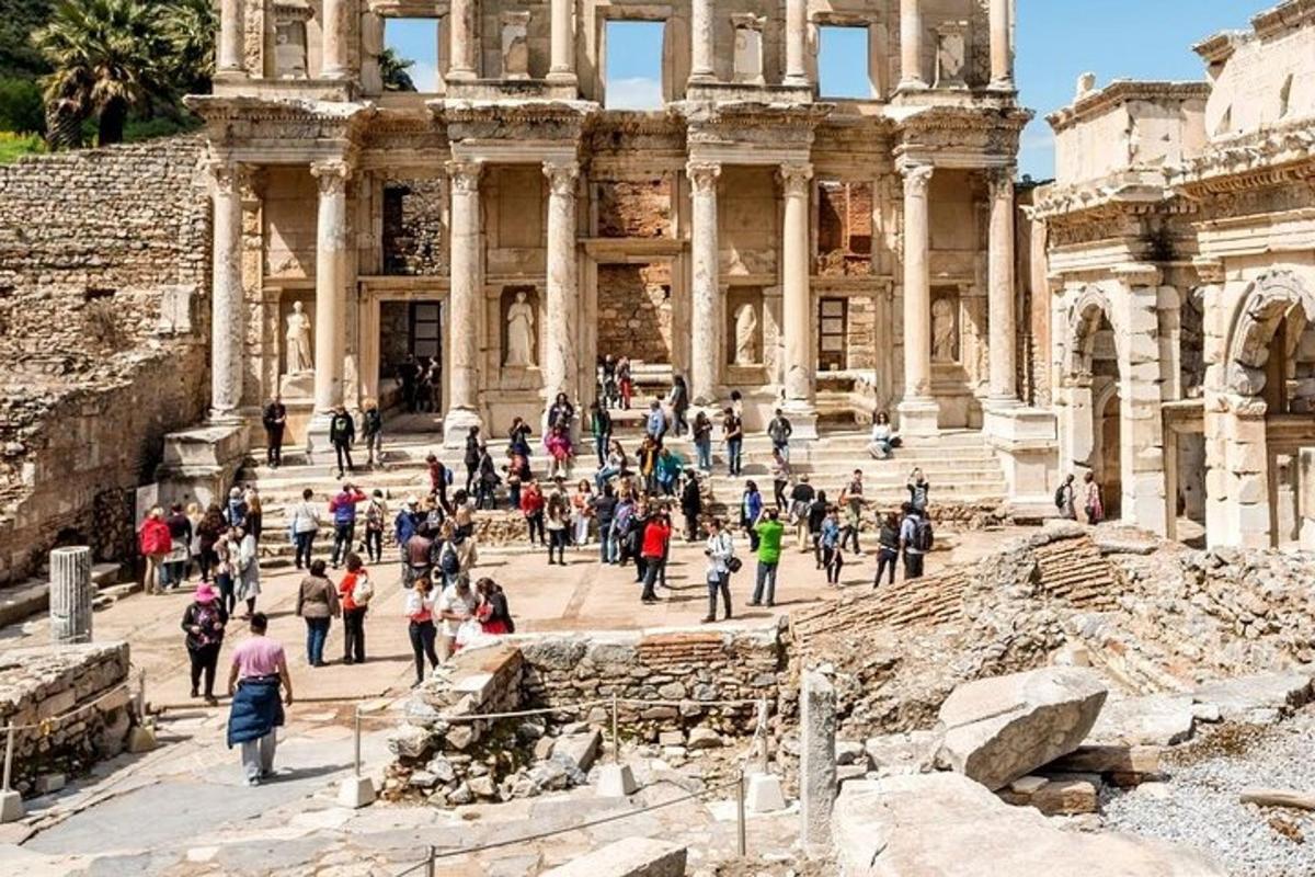 a group of people walking in front of the building