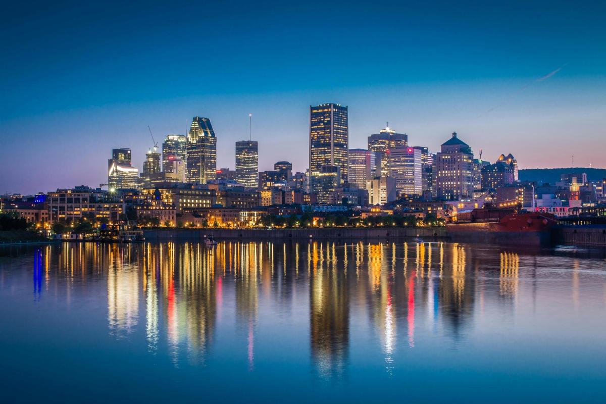 a view of a city at night from the water