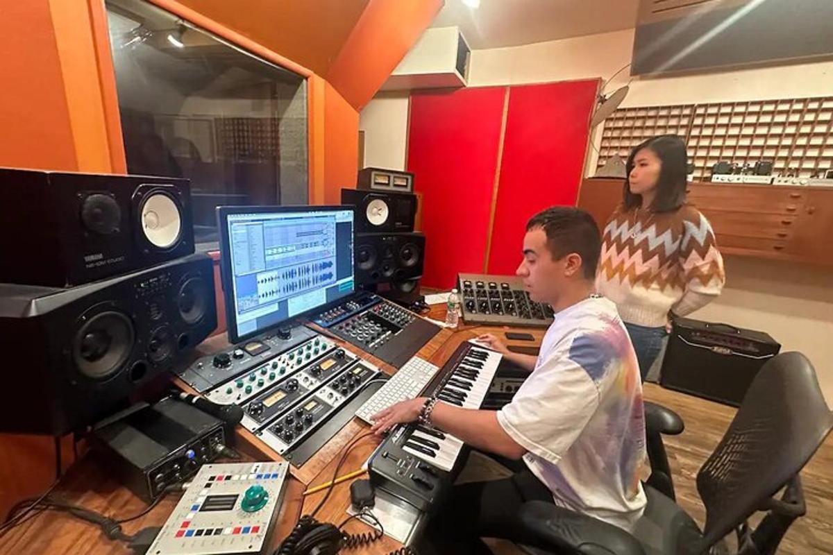 a man and a woman in a recording studio
