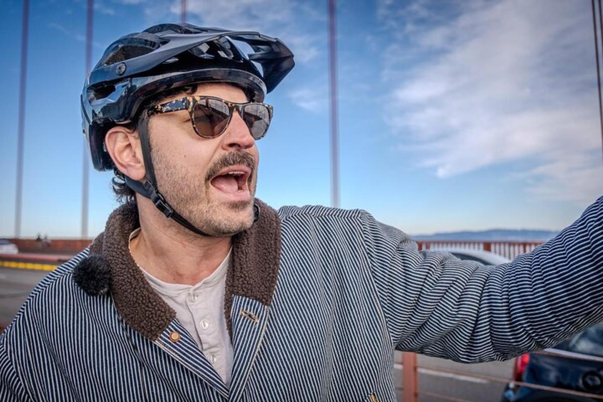 a man wearing a motorcycle helmet and glasses