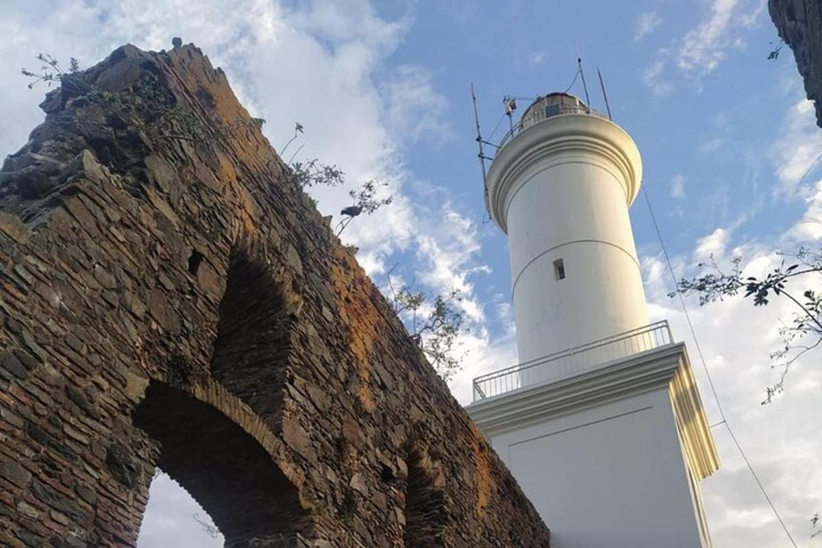 a white lighthouse sitting on top of a building