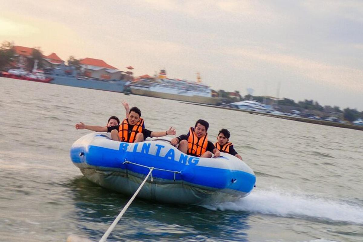 a group of people in a raft in the water